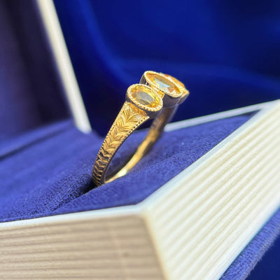 18k Yellow Gold and 2ctw Bezel-low-set 7x5mm with 2pc 6x4mm Oval Yellow Sapphires on Braided Band Custom Ring, size 8