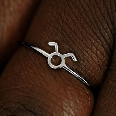 Close up view of a model's fingers wearing a 950 platinum Taurus Horoscope Ring