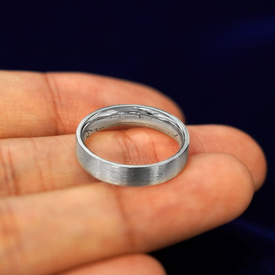 A Platinum Industrial Matte Band with You Are My Favorite Part About Today engraved on the inside of the ring