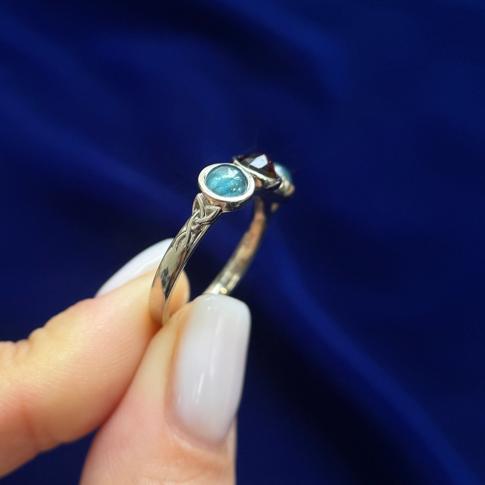 side view of 14k Yellow Gold Bezel-set 5mm Rose-cut Garnet with 2pc 5mm Teal Cabochon Diamonds on a 2.5mm Mix Mirror Band Custom Ring, Size 6