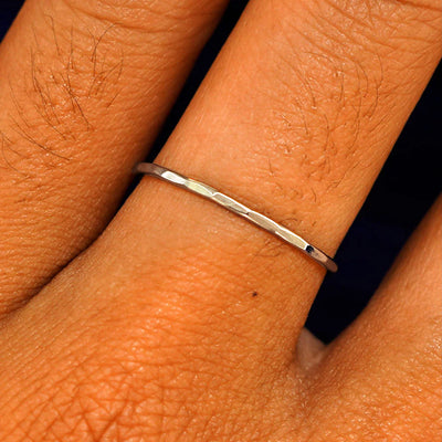 Close up view of a model's fingers wearing a 14k champagne gold Hammered Ring