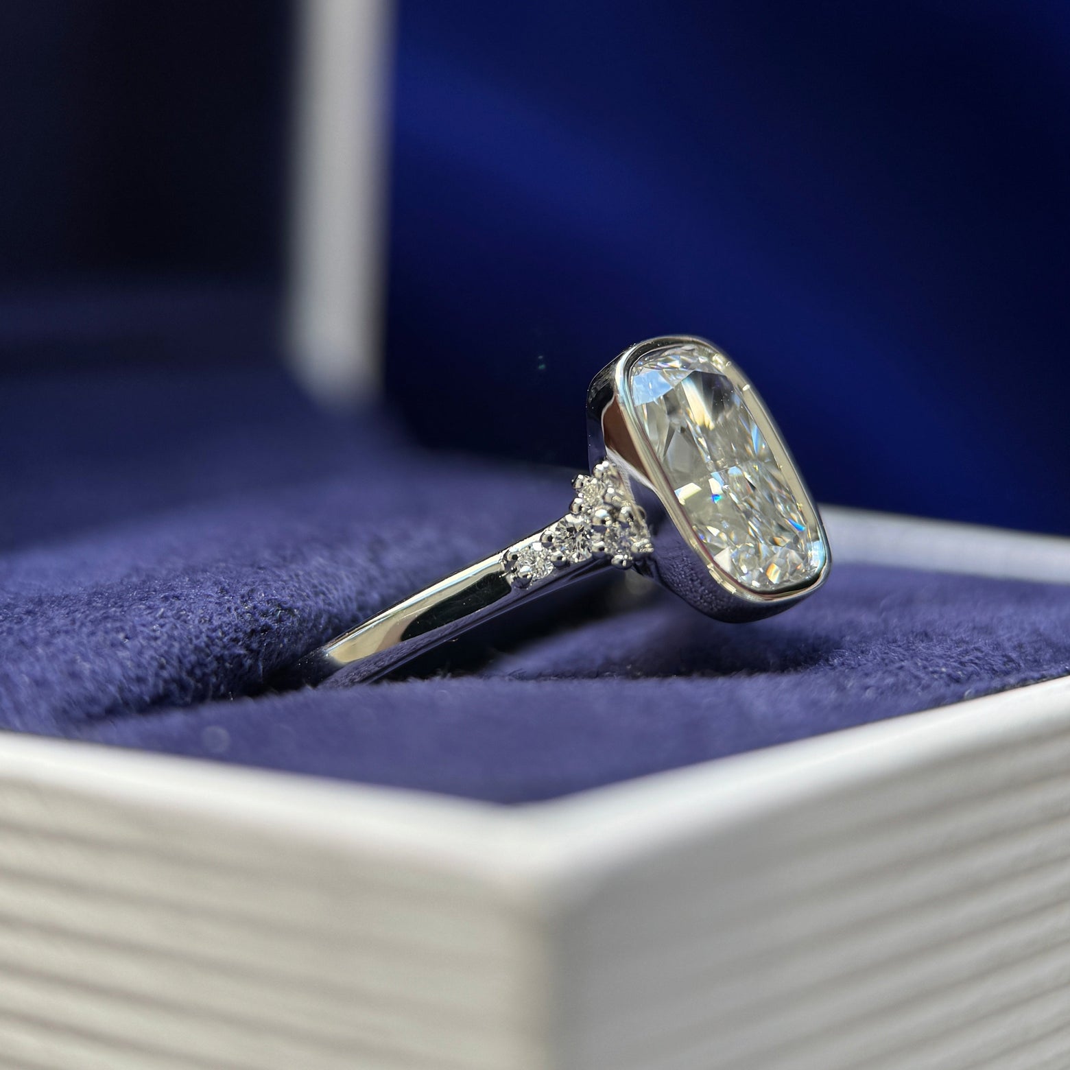 cluster veiw of 950 Platinum & Bezel-High-Cathedral-set 1.5ct Elongated Cushion Lab Diamond with 2pc Small Lab Diamonds on Thin Band Custom Ring, size 5