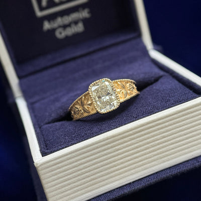 14k Yellow Gold and Low-set Milgrain Bezel 1.5ct Elongated Cushion Lab Diamond on Tapered Milgrain Edge Band Engraves with Flowers three fourths-around Euro Shank Custom Ring, size 6.5