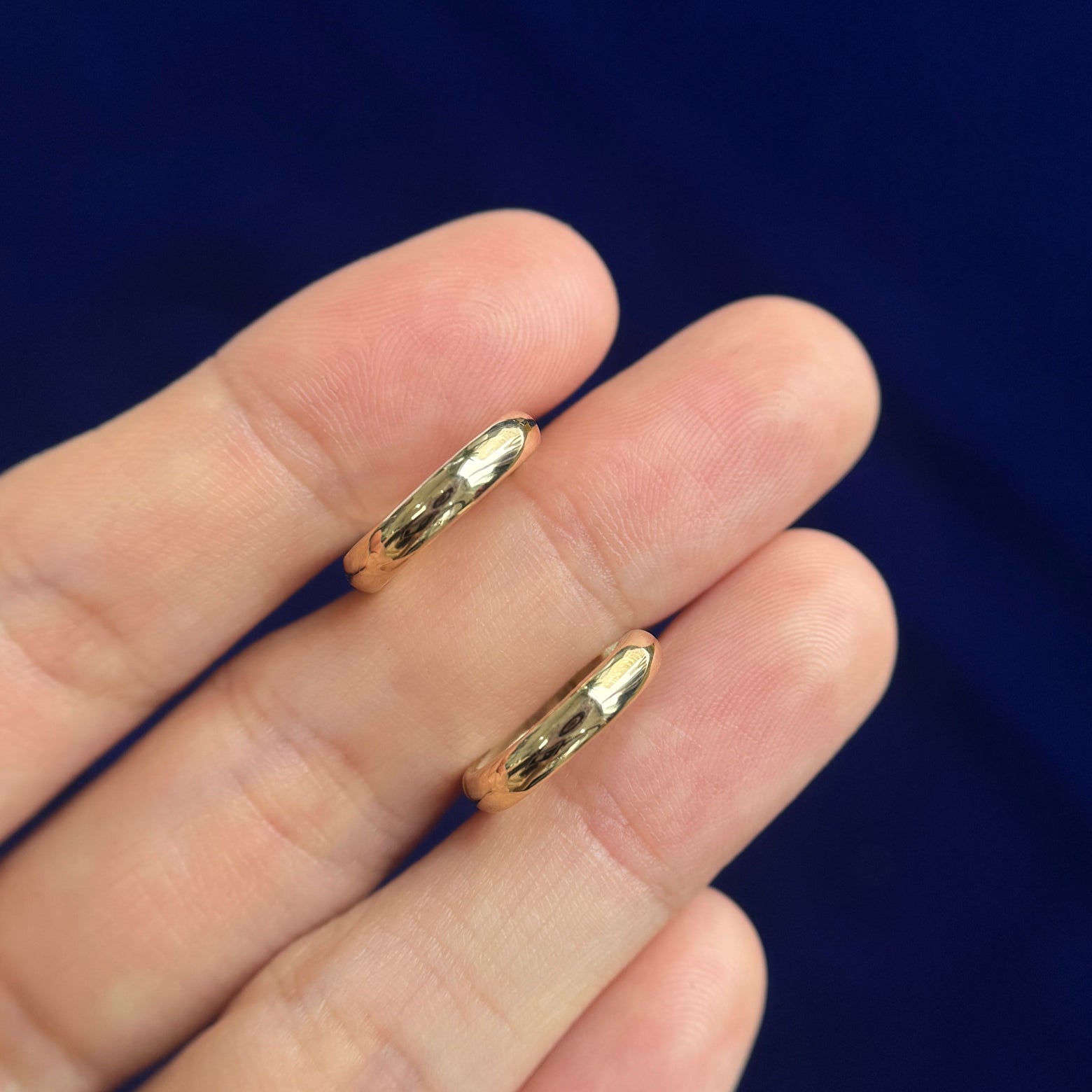 front view of 14k Yellow Gold Curvy Hoops 15mm Outer Diameter Custom Hoops with custom lowered post, Pair