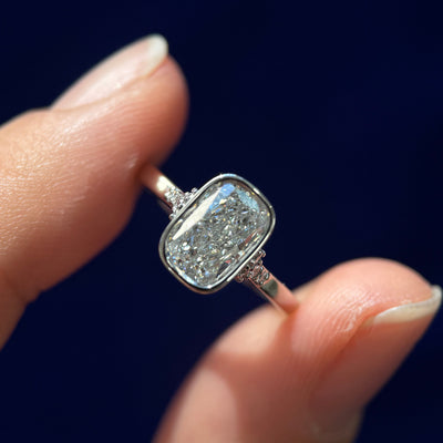 front view of 950 Platinum & Bezel-High-Cathedral-set 1.5ct Elongated Cushion Lab Diamond with 2pc Small Lab Diamonds on Thin Band Custom Ring, size 5