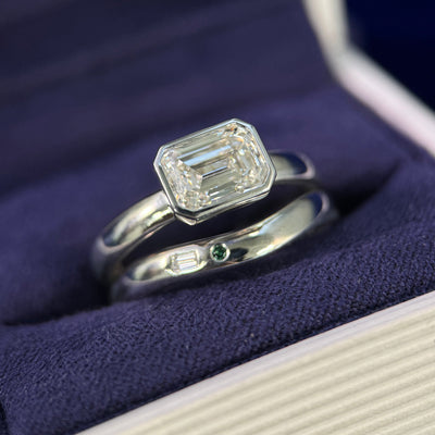 950 Platinum and Bezel-horizontal-set 1.79ct Emerald-cut Lab Diamond on 3mm Mix Mirror Band Custom Ring, size 7.5 and 950 Platinum and Flush-set Customers 2.3mm Baguette and Round Diamonds on 3mm Mix Mirror Nesting Custom Band, size 7.5