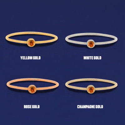 Four versions of the orange Fire Opal Ring shown in options of yellow, white, rose and champagne gold