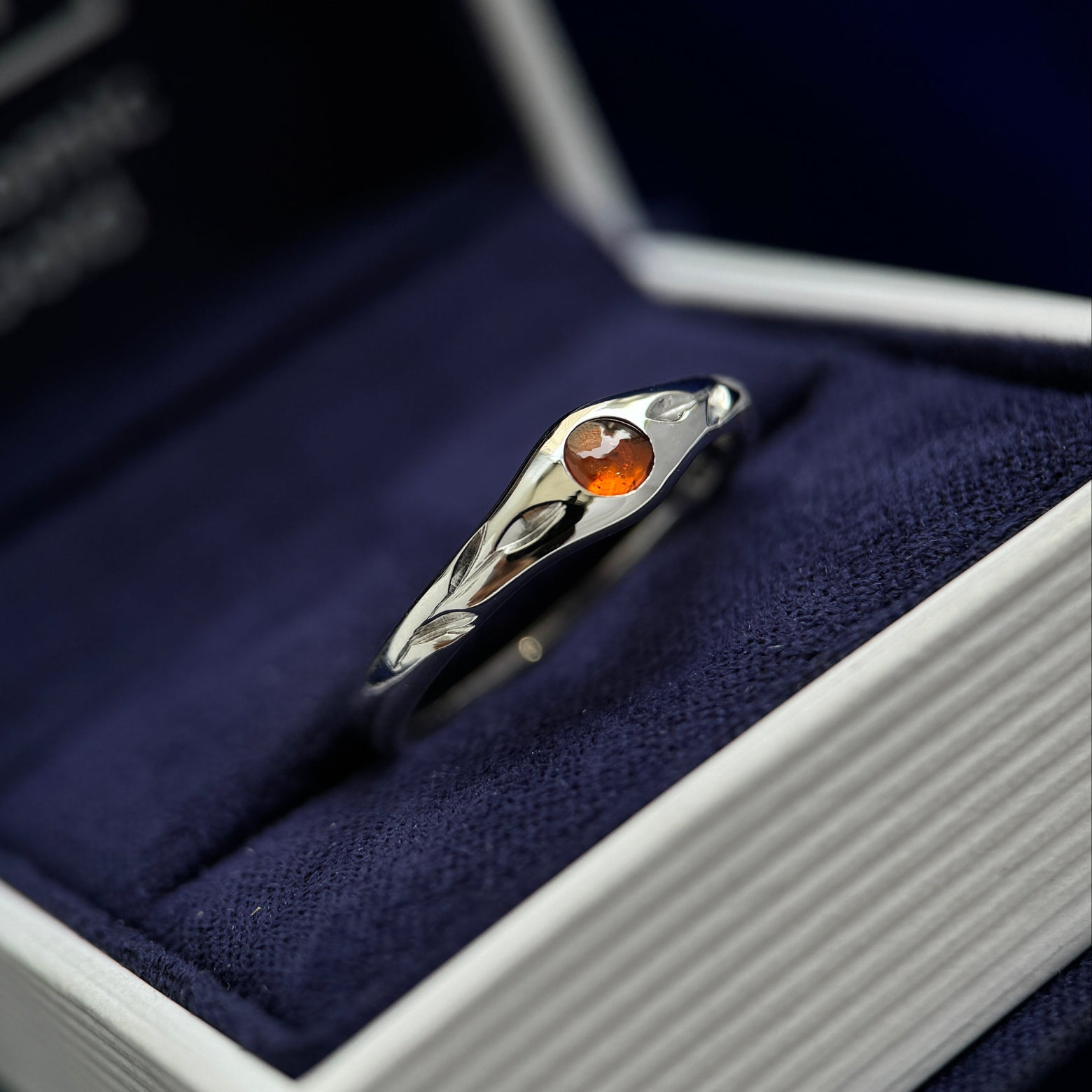 4k White Gold and Flush-set 4mm Round Spessartine with Two Engraved Leaves 5-1.7mm Tapered Band Custom Ring, size 7.75