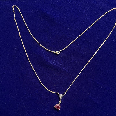 full view of 14k Yellow Gold 1.60ct Trillion Lab Alexandrite and 0.65ct Shield Salt-and-pepper Diamond set on 18" Beaded Chain
