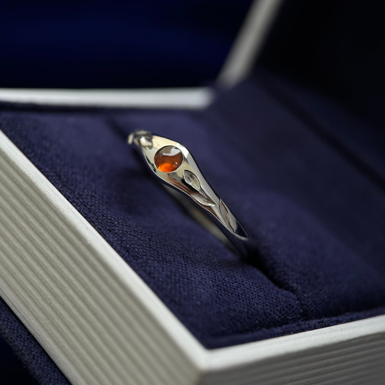 4k White Gold and Flush-set 4mm Round Spessartine with Two Engraved Leaves 5-1.7mm Tapered Band Custom Ring, size 7.75