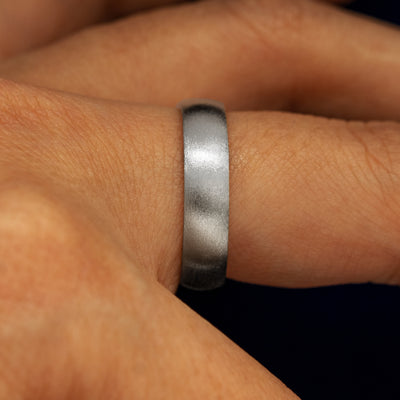 Side view of a solid 925 Silver Mix Matte Band on a model's finger