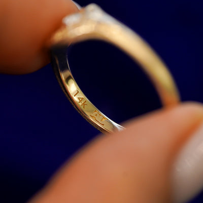 Inside view of a solid gold Pine and Bird Ring to show the AU makers mark and 14k stamp