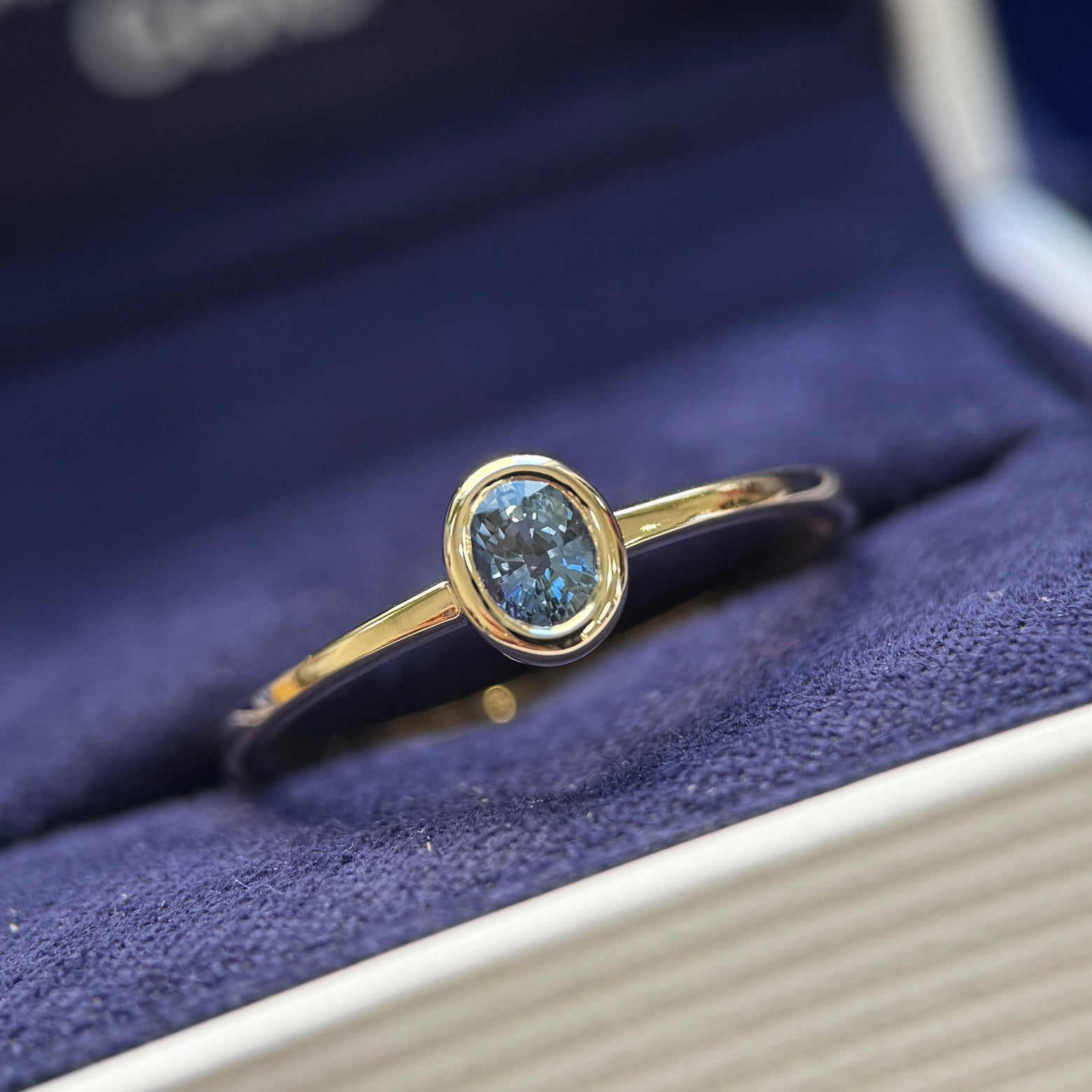14k Yellow Gold and 0.50ct Oval Light Blue Sapphire Bezel Ring Size 7.75
