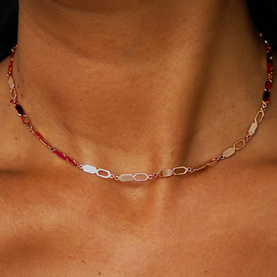 Close up view of a model's neck wearing a solid 14k rose gold Tanlah Chain