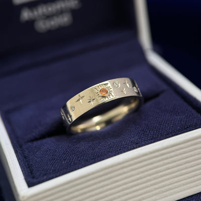 14k Champagne Gold and Round Orange Sapphire in a Sun with 3pc Round Moissanites and Engraved Stars on 5mm Industrial Mirror Band Custom Ring, size 6.5