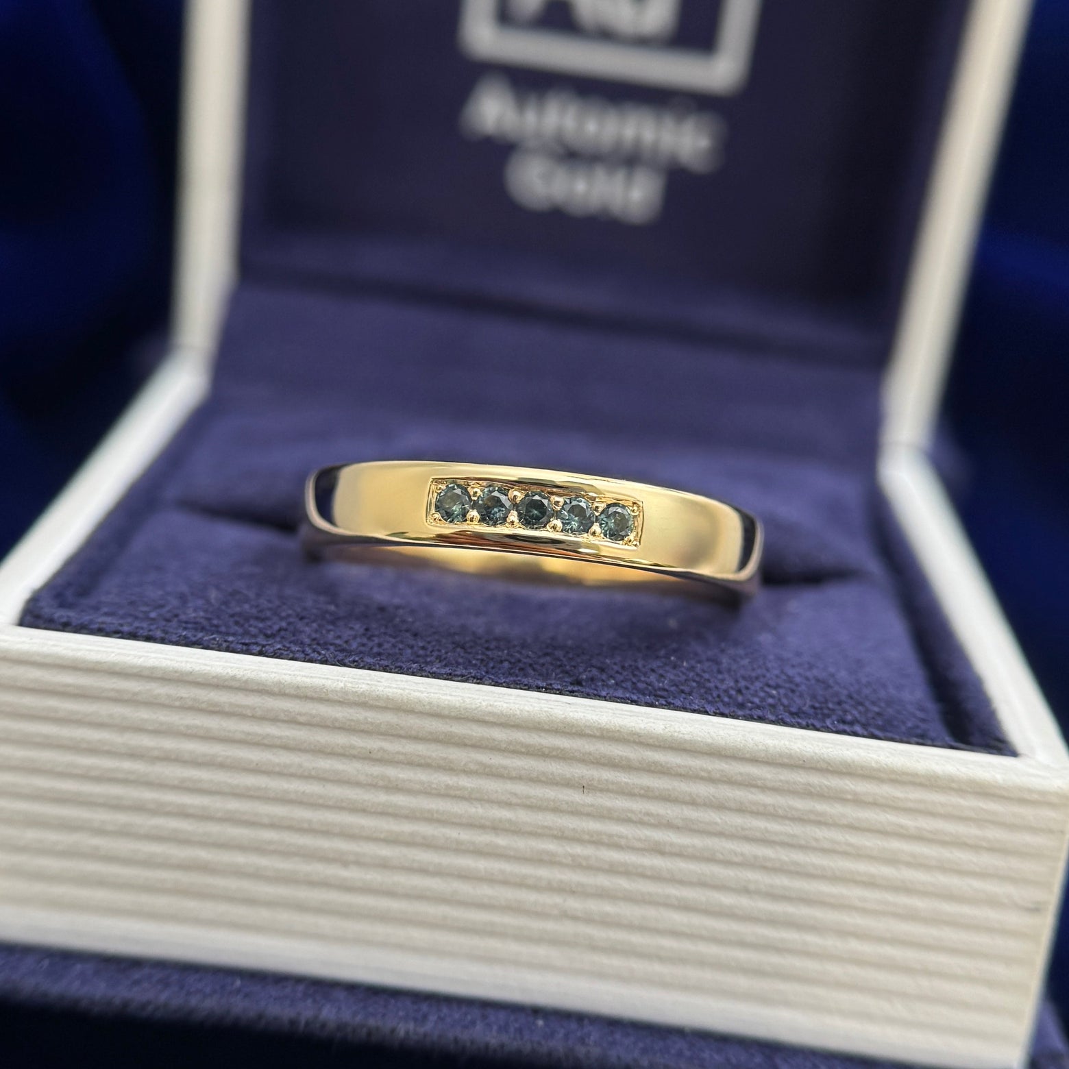 18k Yellow Gold Bead-prongs-set 5x2mm Round Teal Sapphires on 4mm Mix Mirror Band Custom Ring, size 10 and 18k Yellow Gold and 4mm Round Teal Sapphire with 8pc Graduating is size Teal Sapphires on Custom Ring, size 6