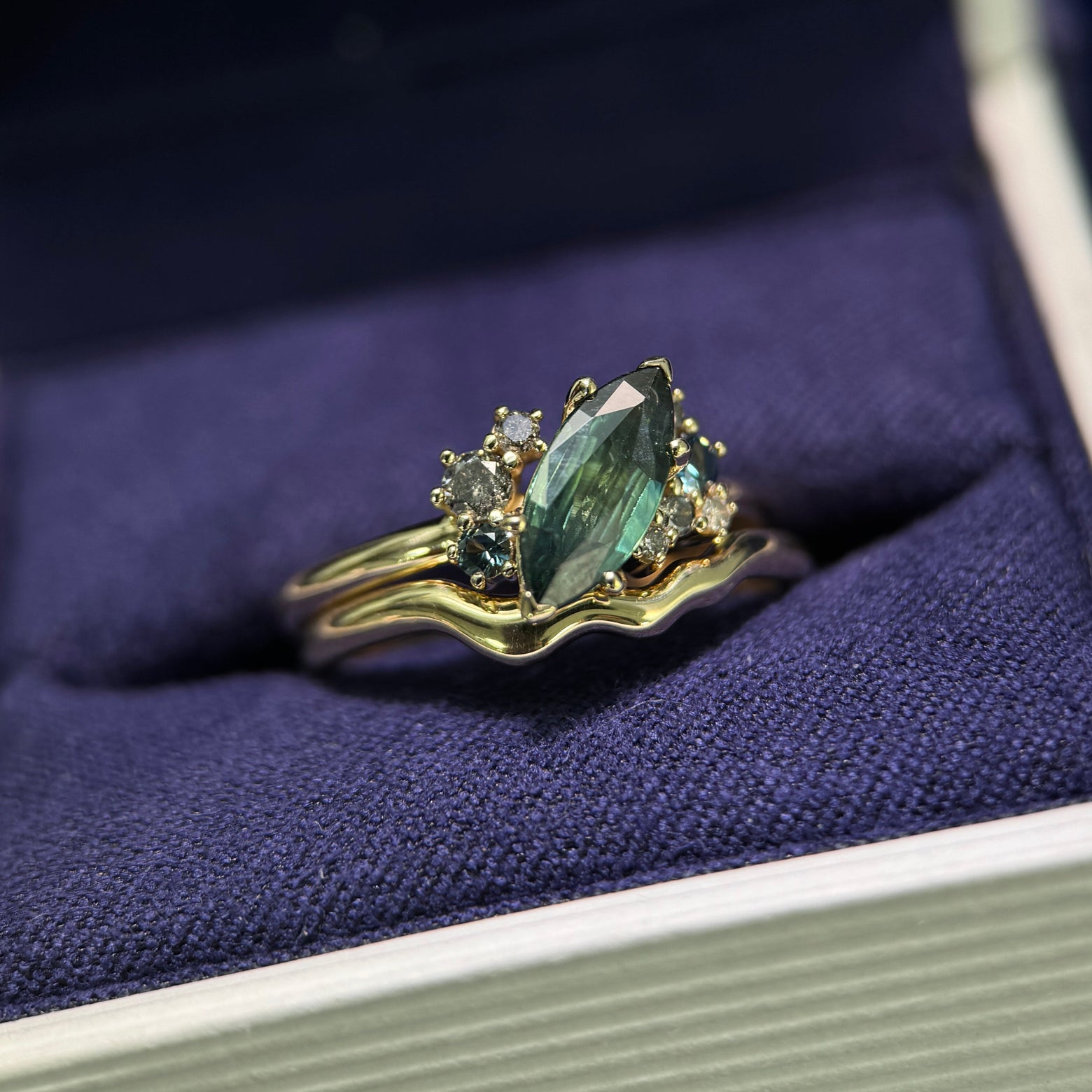 14k Yellow Gold 0.98ct Marquise Teal Sapphire with Cluster of 0.22ctw Sapphires and Salt-and-pepper Diamonds Custom Ring and 14k Yellow Gold Nesting Thin Band, size 6.5