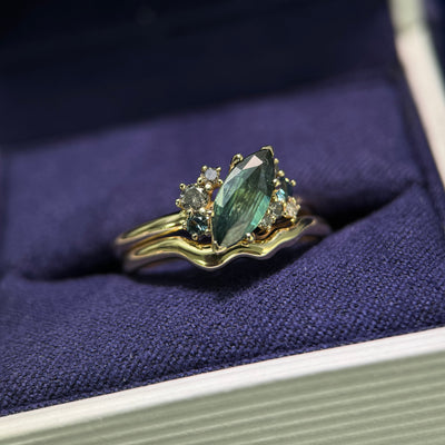14k Yellow Gold 0.98ct Marquise Teal Sapphire with Cluster of 0.22ctw Sapphires and Salt-and-pepper Diamonds Custom Ring and 14k Yellow Gold Nesting Thin Band, size 6.5