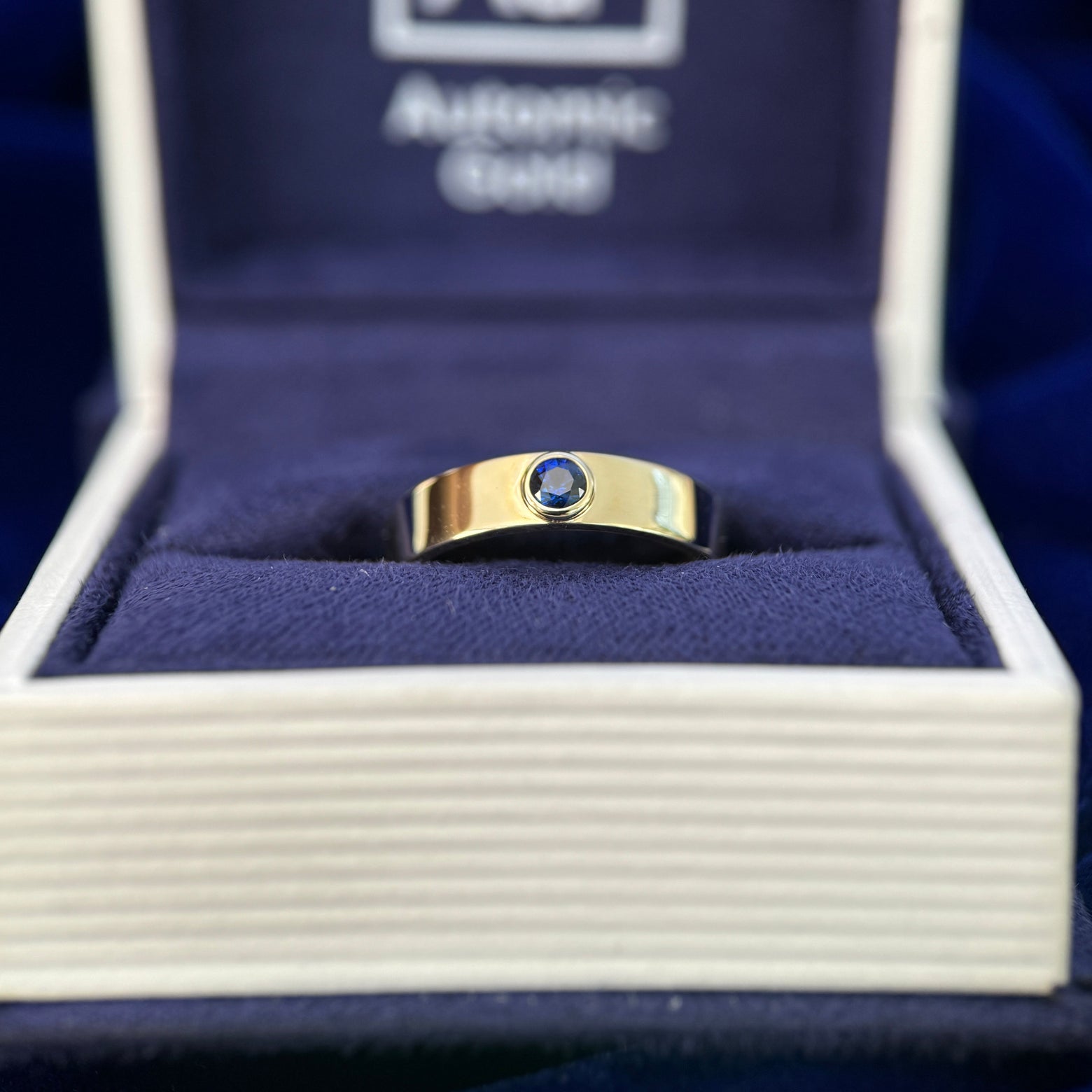 14k Yellow Gold 3mm Sapphire on Custom Gemstone Industrial Band engraved inside " Sorted " in Cormorant Garamond font