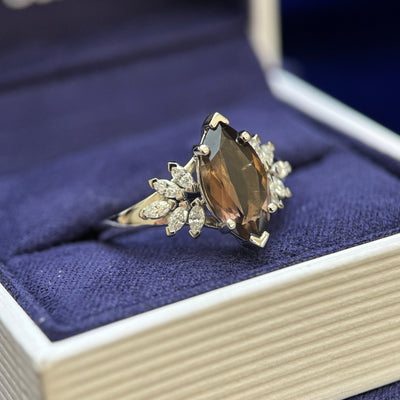 side view of 950 Platinum and 1.5ct 12x6mm Marquise Brown Topaz with 10pc Marquise Lab Diamonds on 2mm Band Custom Ring, size 6