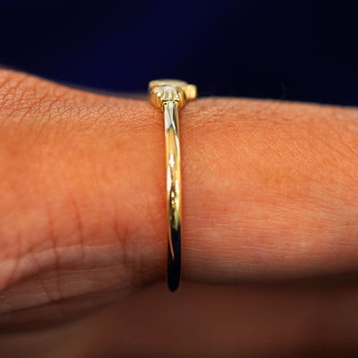 Side view of a Thin Claddagh Ring on a model's finger
