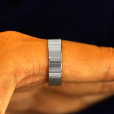 Side view of a Silver Industrial Mirror Band on a model's finger