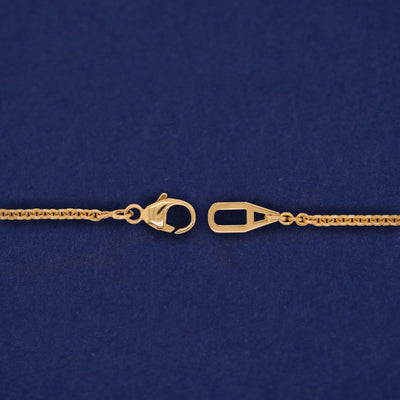 Close up view of an unclasped AU lobster claw clasp on a Bound Together Necklace