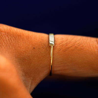 Side view of a Bar Ring on a model's finger