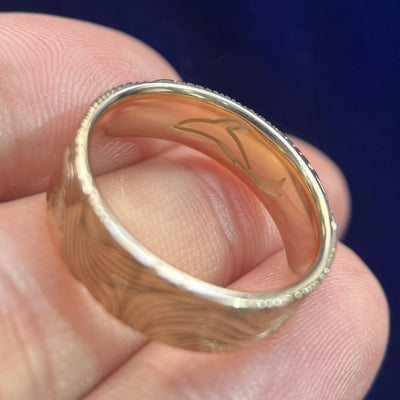 close-up of whale engraving inside of 14k Yellow Gold Unique Non-repeating Waves Engraved Outside and Whale Engraved on the inside of 6mm Industrial Comfort-fit Band Custom Ring, size 7
