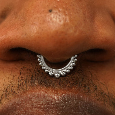 Close up view of a model's nose wearing a 14k white gold Beaded Septum