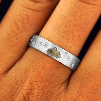 Close up view of a model's fingers wearing a 14k white gold Cloud Diamond Band