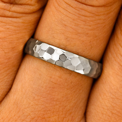 Close up view of a model's fingers wearing a 14k White Gold Curvy Hammered Band