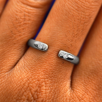 Close up view of a model's fingers wearing a 14k white gold Open Curvy Band