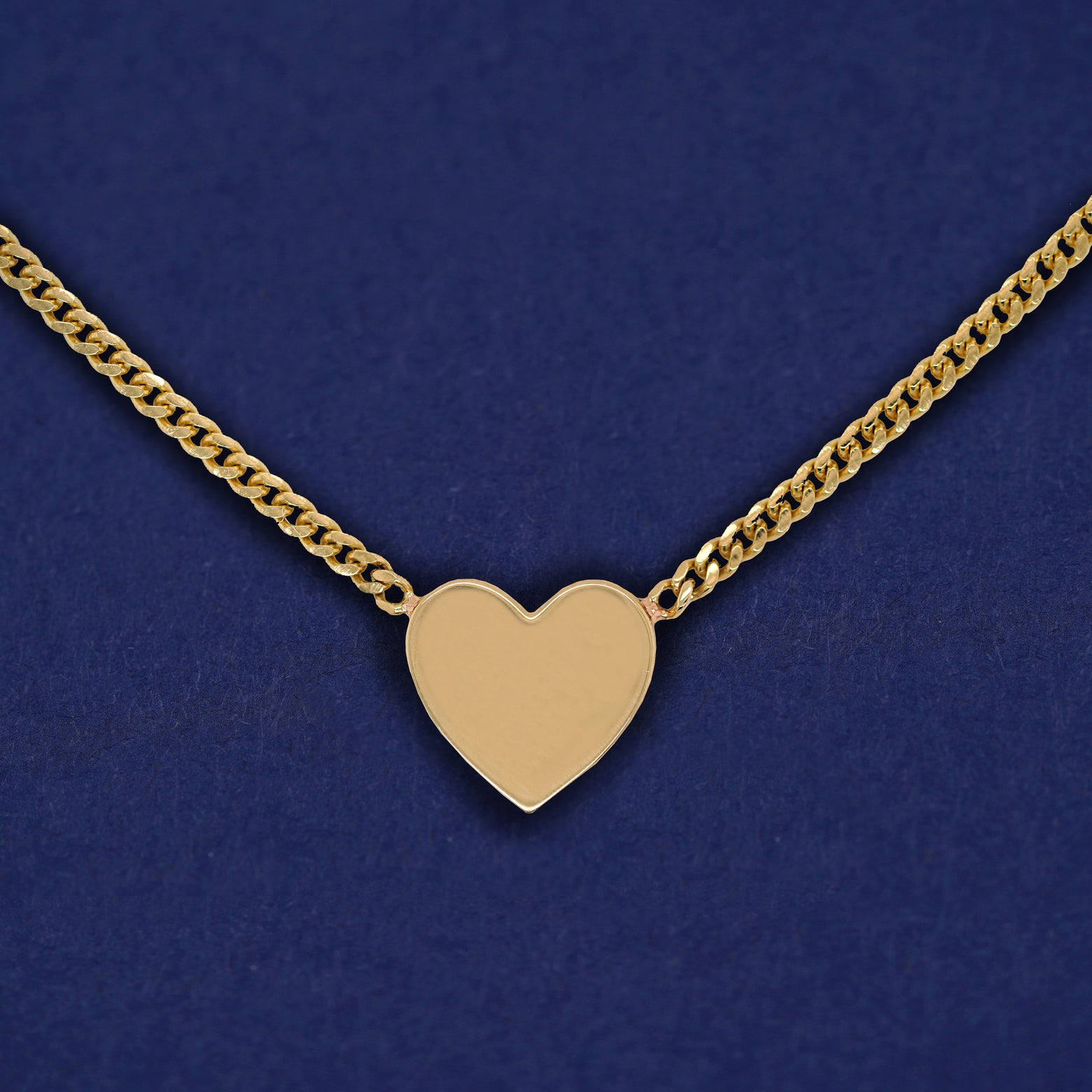 Reverse side of the Enamel Heart Necklace showing a solid yellow gold heart